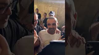 Crowds cheer for the passengers who were on the FlyDubai flight