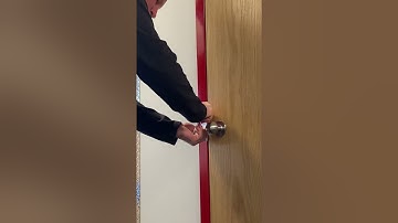 The In&Out GOAT Firefighter Swipe Tool on an outward opening door