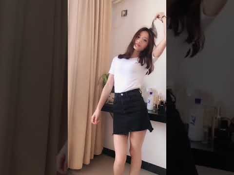 An Asian girl in a short skirt is dancing 4