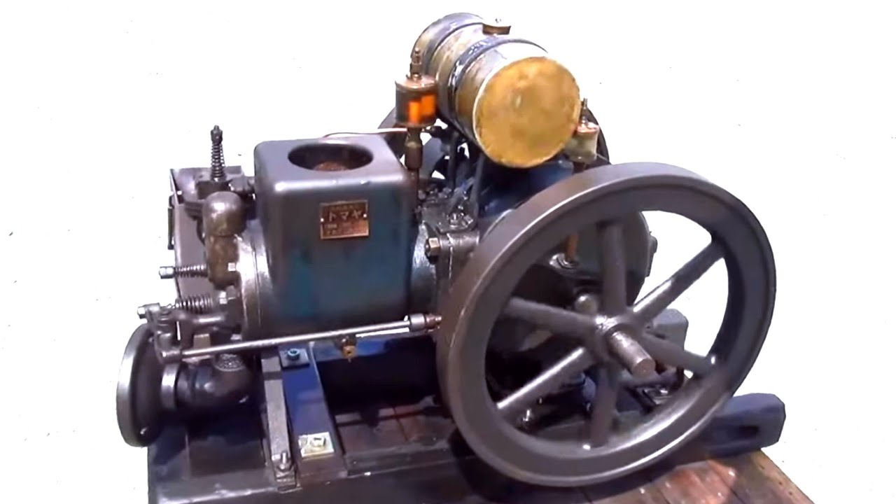 An old-fashioned, horizontal, water-cooled hot-bulb engine from
