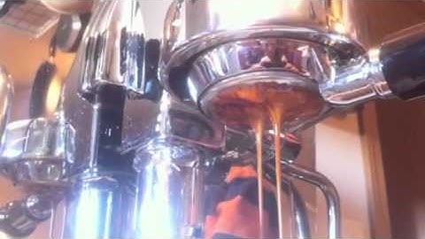 Making expresso. Rocket with bottomless portafilter