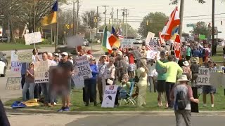 Hundreds gather outside Raleigh Tesla dealership to protest Elon Musk