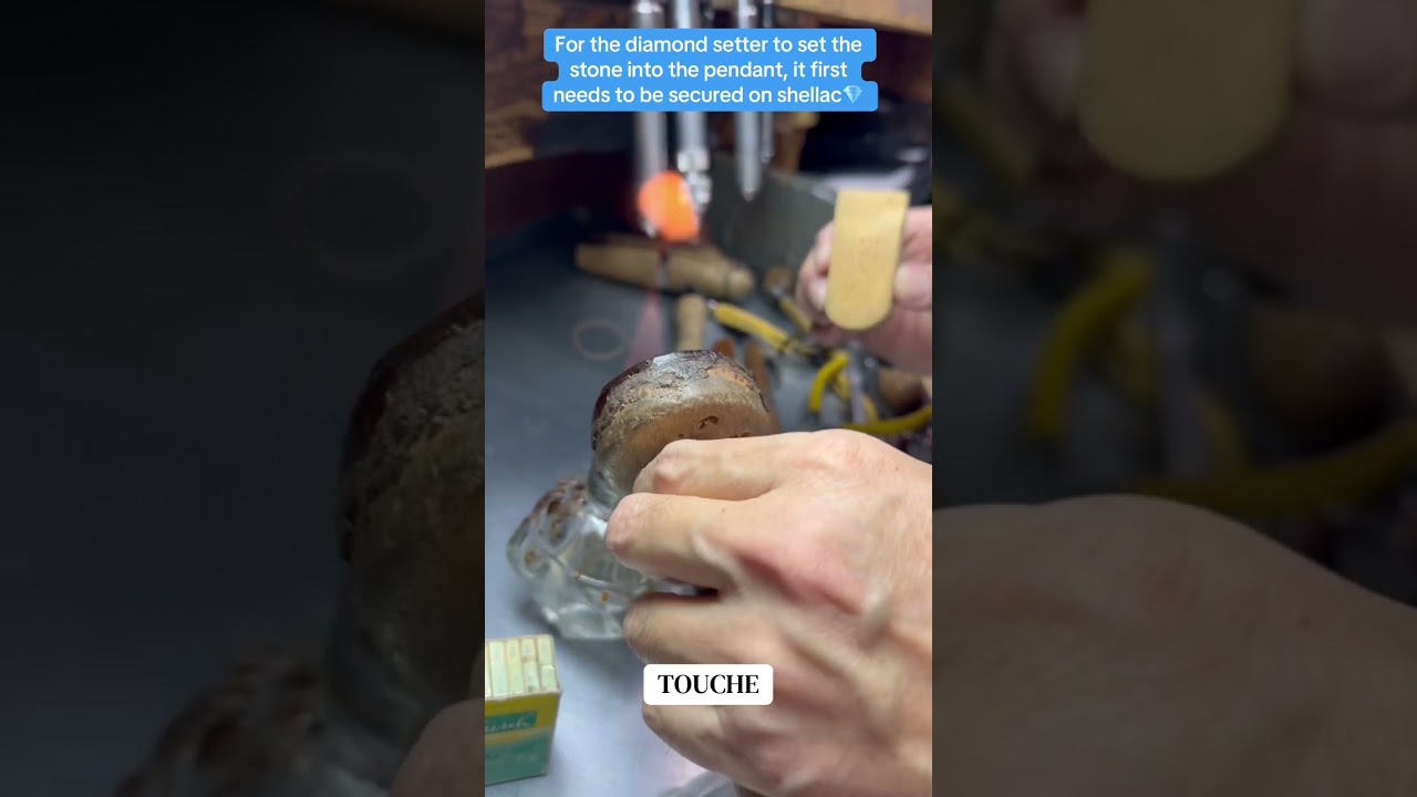 For the diamond setter to set the stone into the pendant, it first needs to be secured on shellac!
