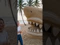 shark-house built entirely from sand, detailed sand architecture with realistic textures,