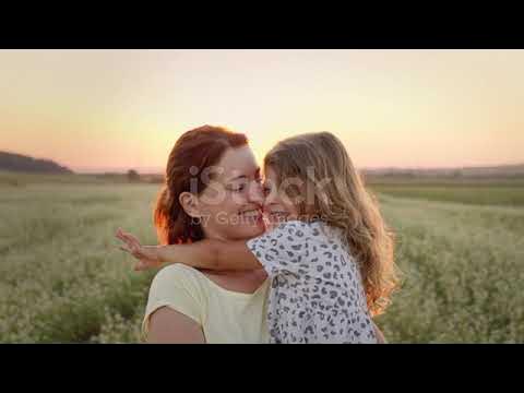 Mother and Cute Daughter Kissing | Stock Video