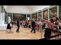 Visiting Mona Lisa at the Louvre on a busy summer day