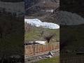 Avalanche creeps down a mountainside