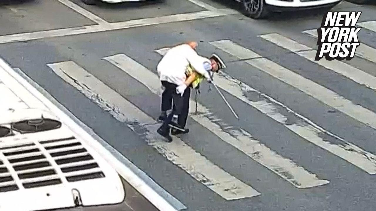 Police Officer Helps Elderly Man Across The Street On His Back Youtube