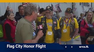 91 local veterans return to Toledo after Flag City Honor Flight