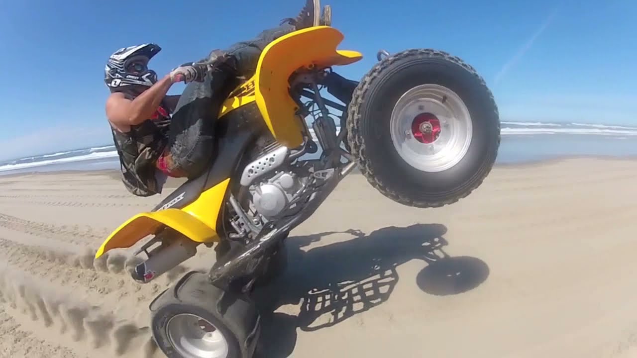 Crazy beach wheelies YouTube