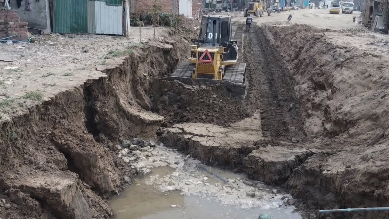 Komatsu Dozer Pushing Sand Filling Bury Sewage And Crack In Village