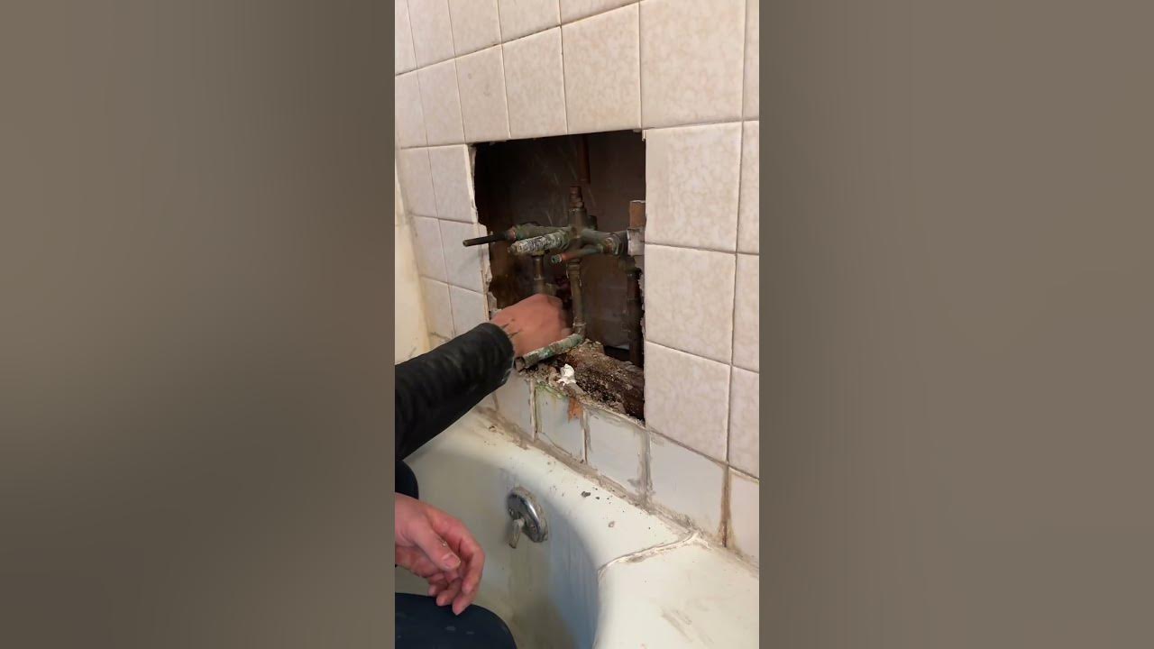 Converting a shower valve from a three handle to single handle valve