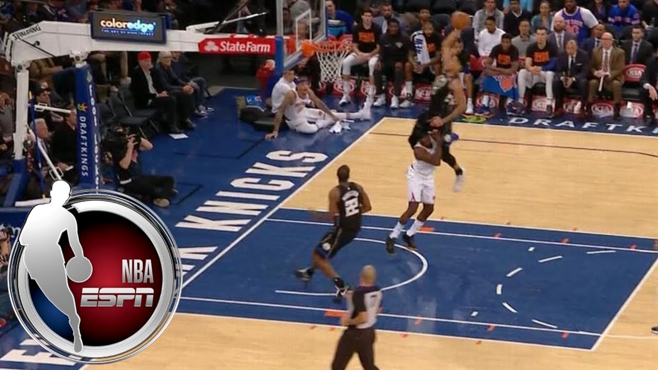 Bucks star Giannis Antetokounmpo dunks over Knicks' Tim Hardaway Jr.