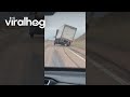 Strong Winds Lift Semi Truck Driving on the Highway || ViralHog