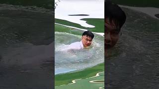 This man jumped into the river while still wearing his neat work clothes #shorts