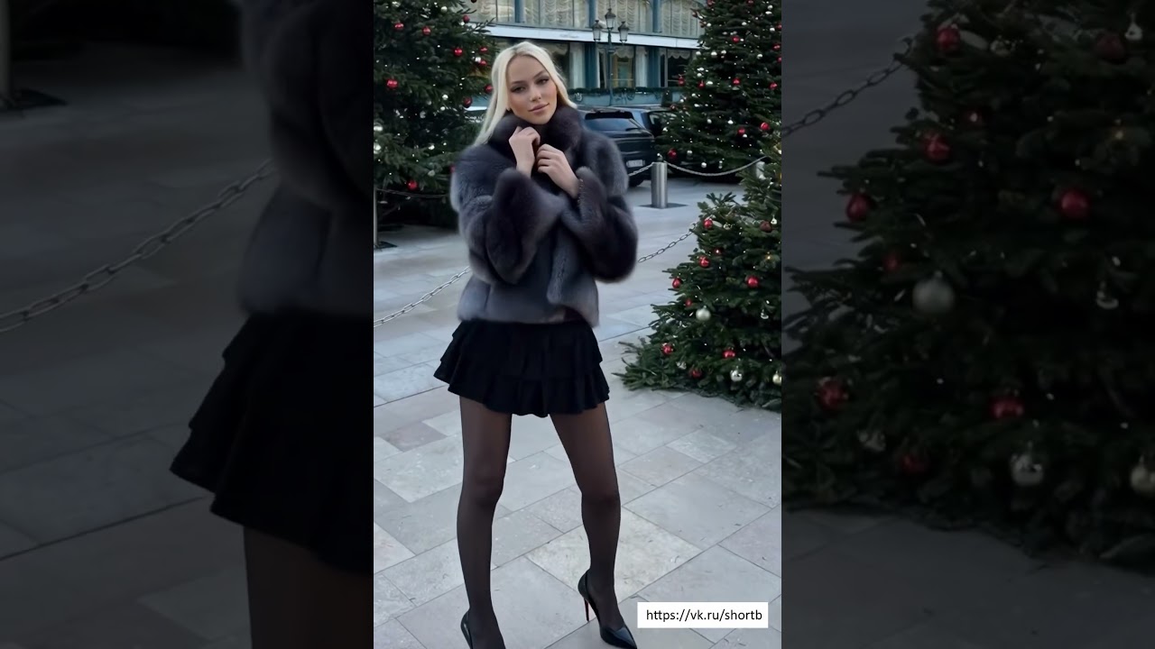 a girl in a short skirt at the Christmas tree