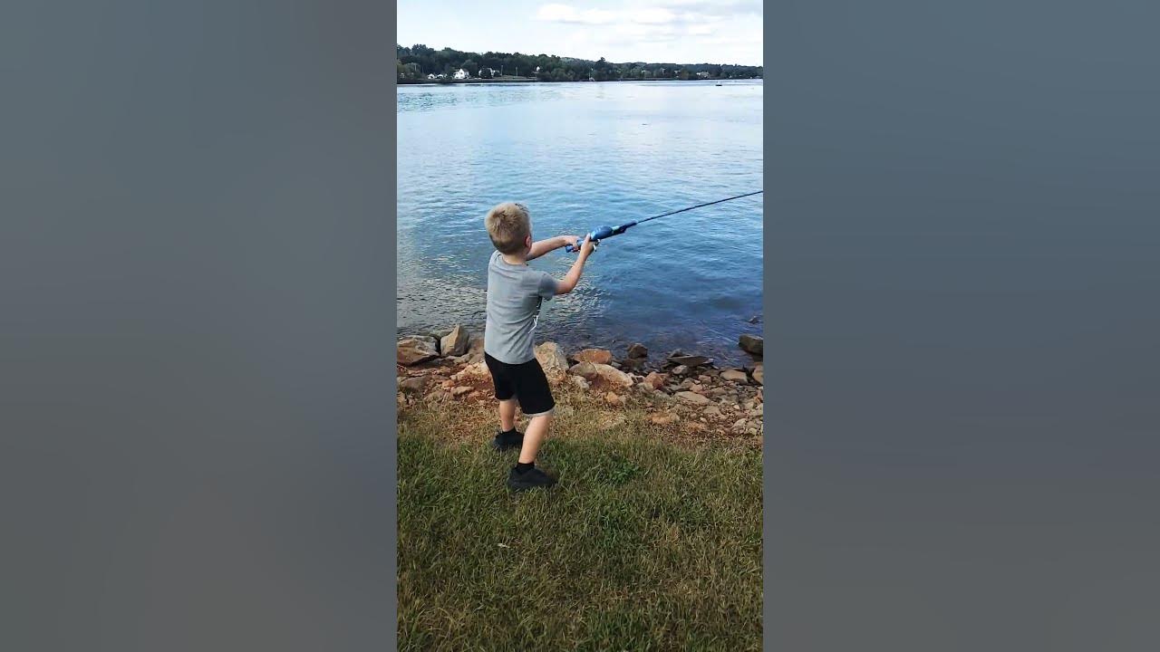 Boy casting a fishing rod 