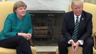 Awkward moment as Donald Trump 'IGNORES' Angela Merkel's offer of a handshake in White House