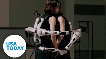 Futuristic backpack includes robotic arms, interchangeable hands | USA TODAY