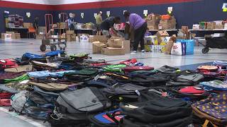 Volunteers organize 2 Pack a Backpack donations