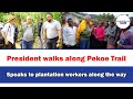 President walks along pekoe trailspeaks to plantation workers along the way