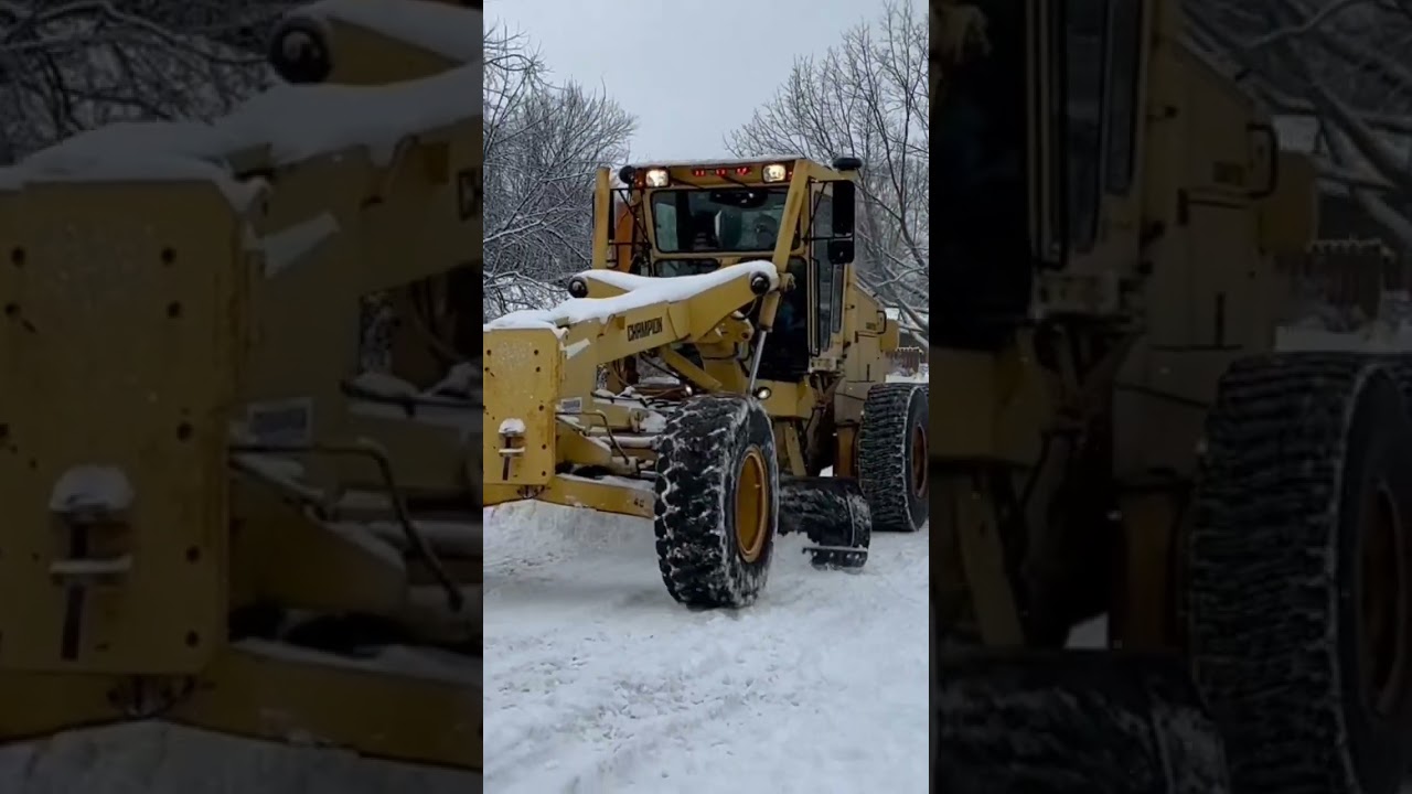 Old Grader Plowing Snow 