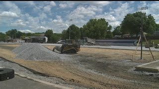 Crews prepare to lay down new turf field at Salem football stadium