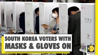 South Korea heads to polls amid coronavirus outbreak | Voters turn up with masks and gloves