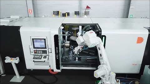 DENN NTR-130/50 metal spinning & shear forming machine with robotic loading and unloading