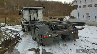 Loading and unloading roll off dumpster