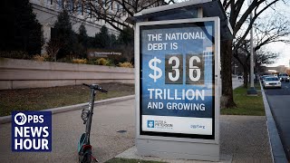 Credit rating downgrade triggers warning signs for U.S. economy
