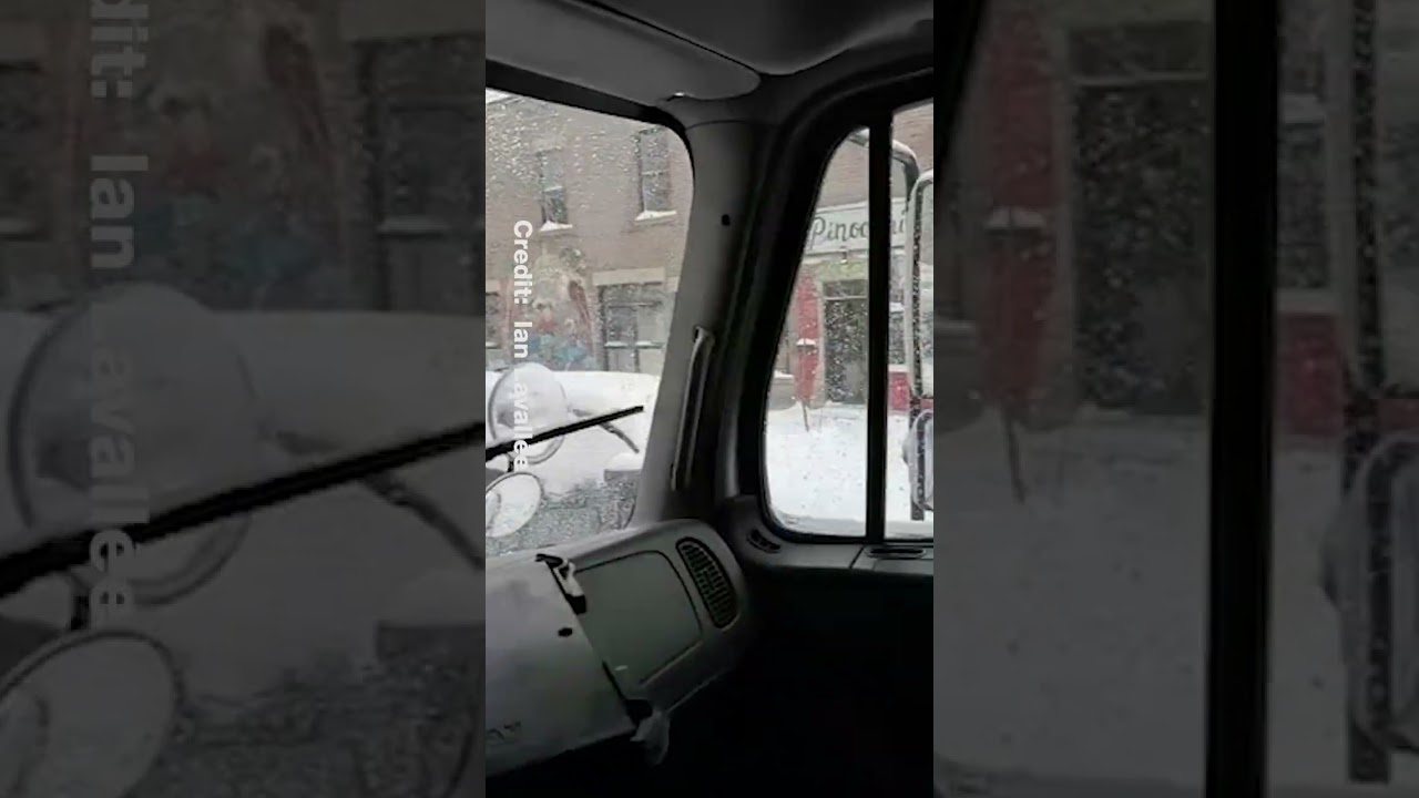 Car driving completely covered in Montreal