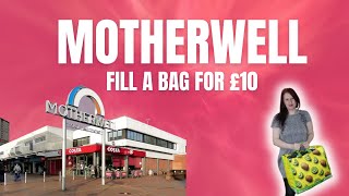 Hand picking stock at Motherwell Charity Shop's fill a bag event