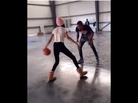 Krissy and Funnymike in the warehouse playing basketball