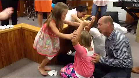 Kids ministering under the Holy Spirit