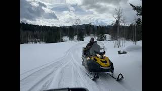 Men sledding on snowmobiles - KCC men's outing March 2023