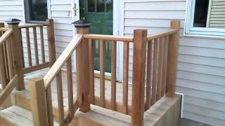 Cedar deck with led solar lights and powdercoated copper caps.