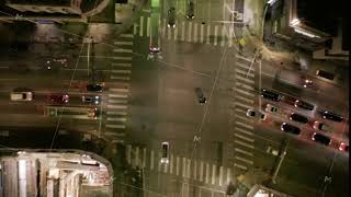 AERIAL HYPER LAPSE: Road Intersection at Night with Car Traffic and City Lights Time Lapse in Los