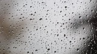 Rain pattering gently against a window, ASMR, no talking