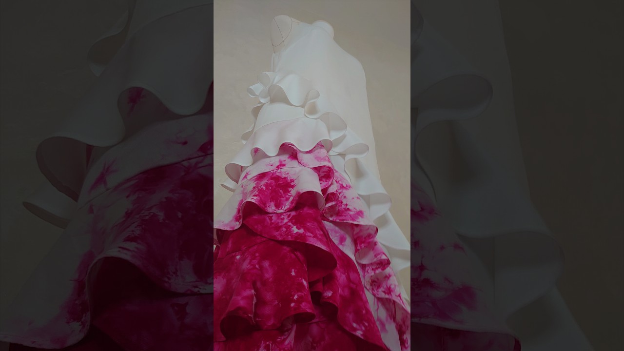 Designer long dress. Refined elongated silhouette. Gradient asymmetrical flounces.