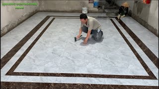 Professional Living Room Floor Construction Workers With Ceramic Tiles Cut and Decorate Tile Borders