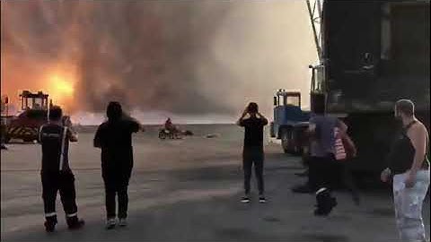 Slow-motion Beirut explosion from waterfront near blast site