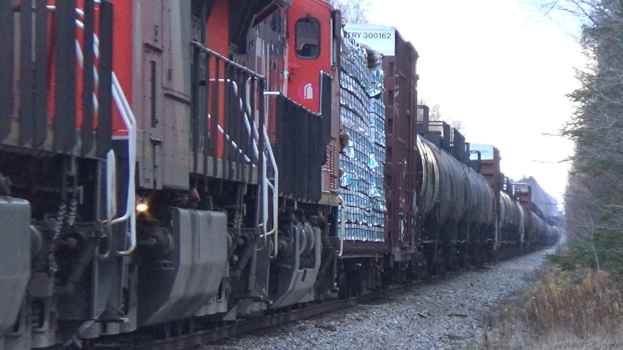 Very Long Freight Train CN 594 West w/Containers approaching River Glade, NB