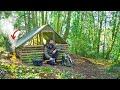 Survival shelter with fireplace  2 days solo bushcraft in the woods