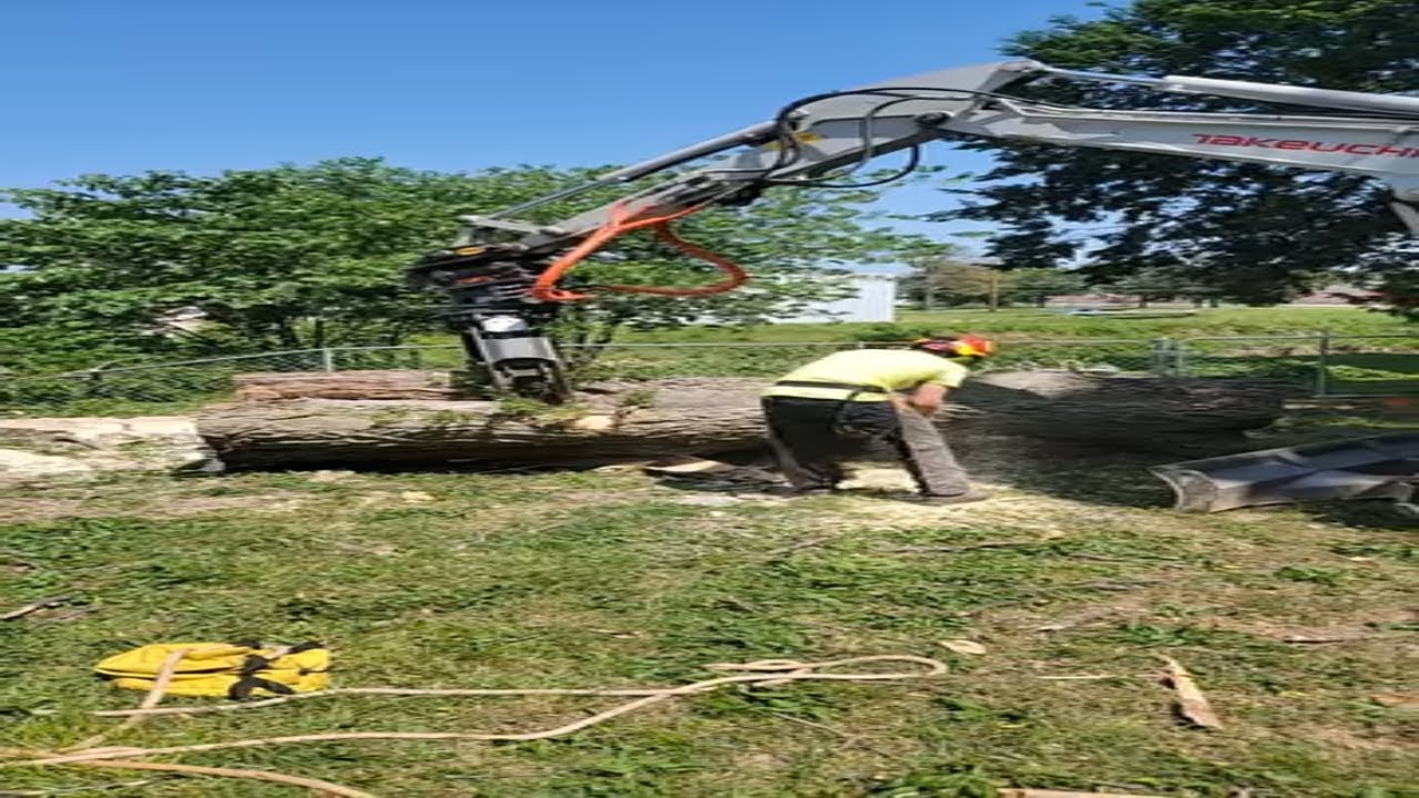 Using an excavator with a grapple