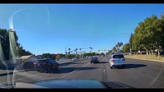 WOMAN STOPS IN THE MIDDLE OF A BUSY ROAD