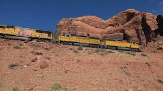 Union Pacific local potash train dwarfed by red rocks in Moab, Utah