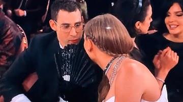 Taylor Swift covers mouth with fan at Grammys 2024 after viral Golden Globes gossip session