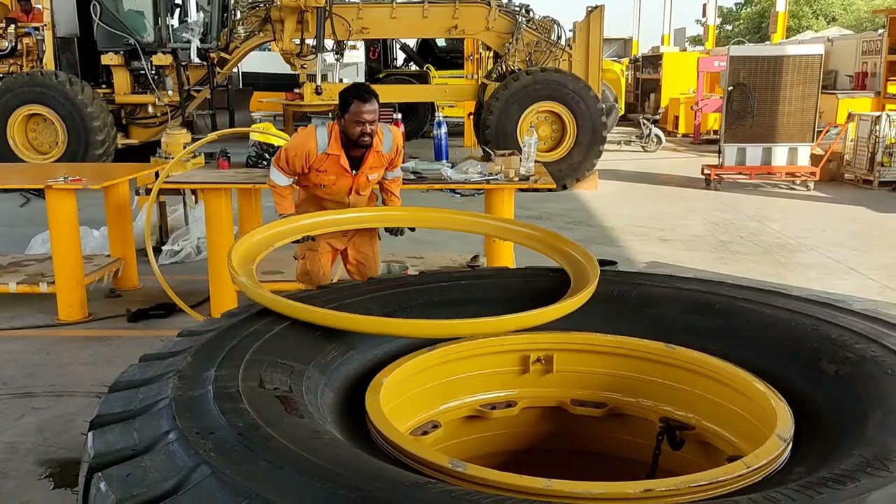 this is how to change the big tire for  Caterpillar 777E haul truck. skilled tire man. #caterpillar