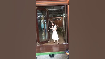 Cửa nhôm thuỷ lực vân gỗ - kính hộp nan đồng - góc đồng. Nhôm Kính Đức Thành